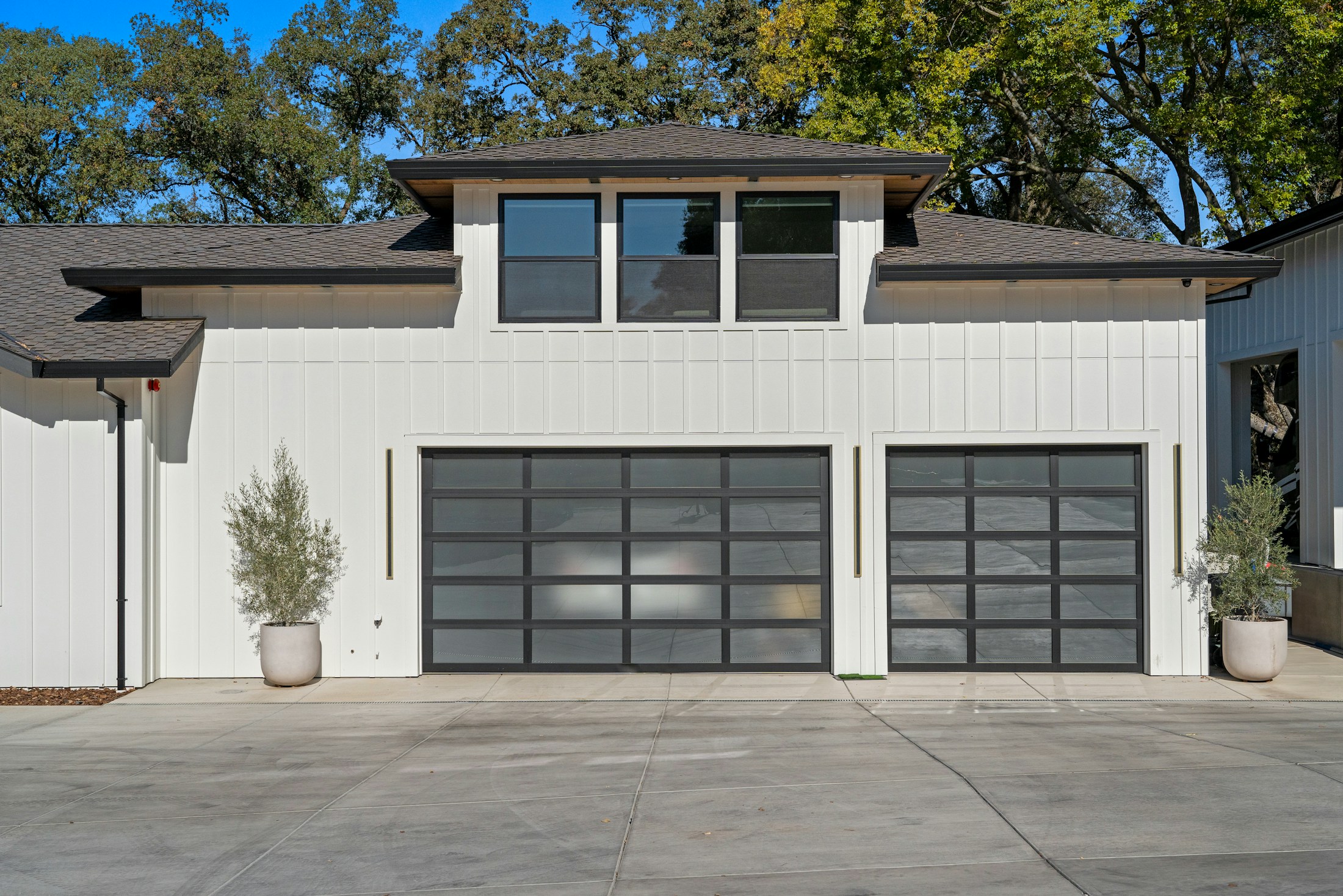 Residential home with a wide closed garage door