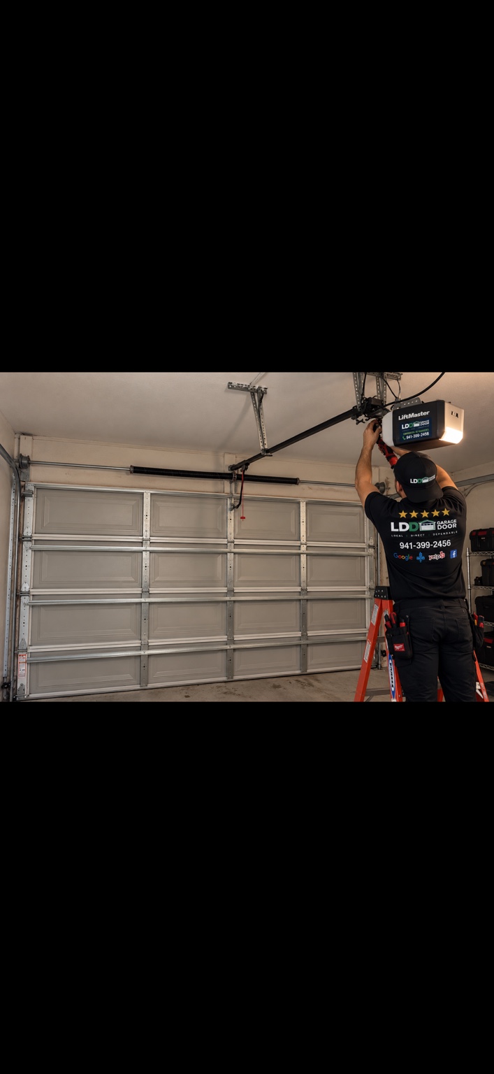 LDD technician working on a LiftMaster garage door opener